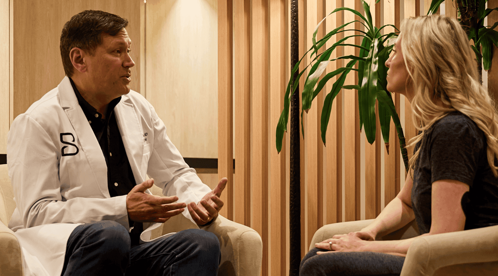 Doctor-led consultation at Biograph explaining personalized health plan and results from longevity testing and preventive screening.