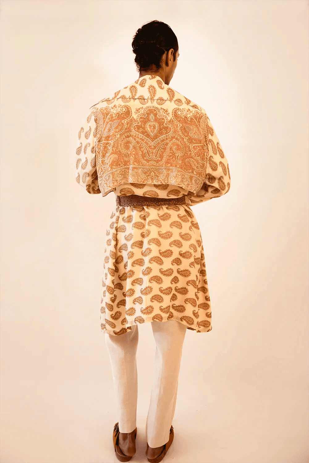 Vedya is our one-of-a-kind beige paisley silk trench coat, handcrafted by skilled artisans in-house using a vintage silk sari. 