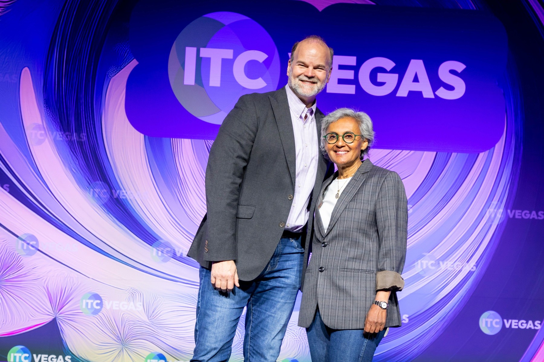 Elysian Founder and CEO Grace Hanson with Marcus Rohlfs, Silicon Valley Technology Scouting Leader at State Farm Ventures, celebrating Elysian’s win at the 2025 State Farm Startup Pitch Competition during ITC Vegas.
