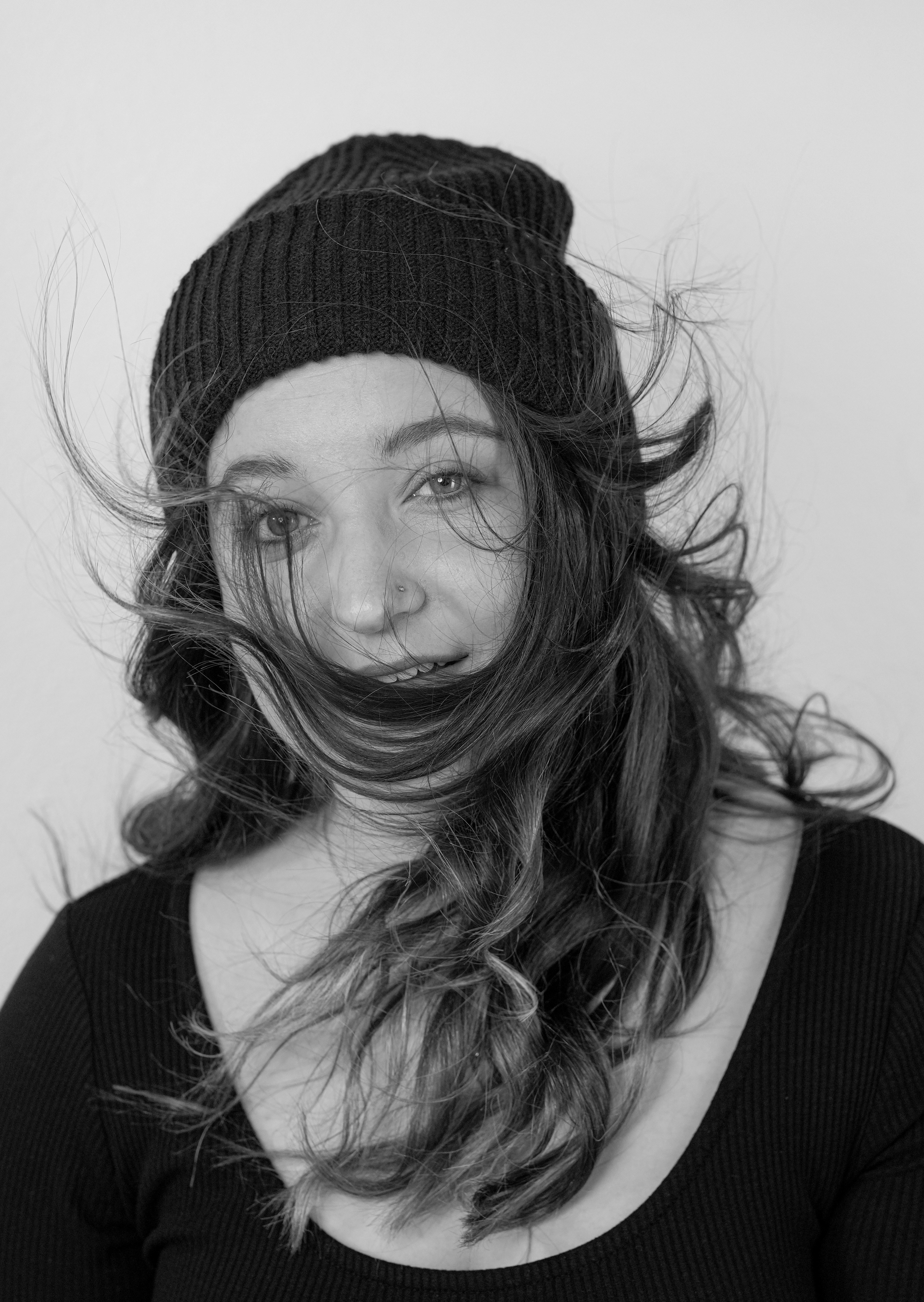 A woman with long hair and a mustache