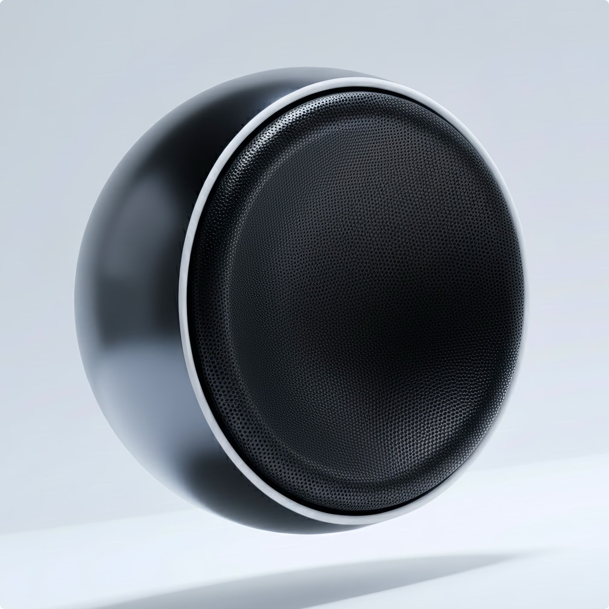 Modern table lamp with a black base and white shade casting a warm glow on a neutral background.