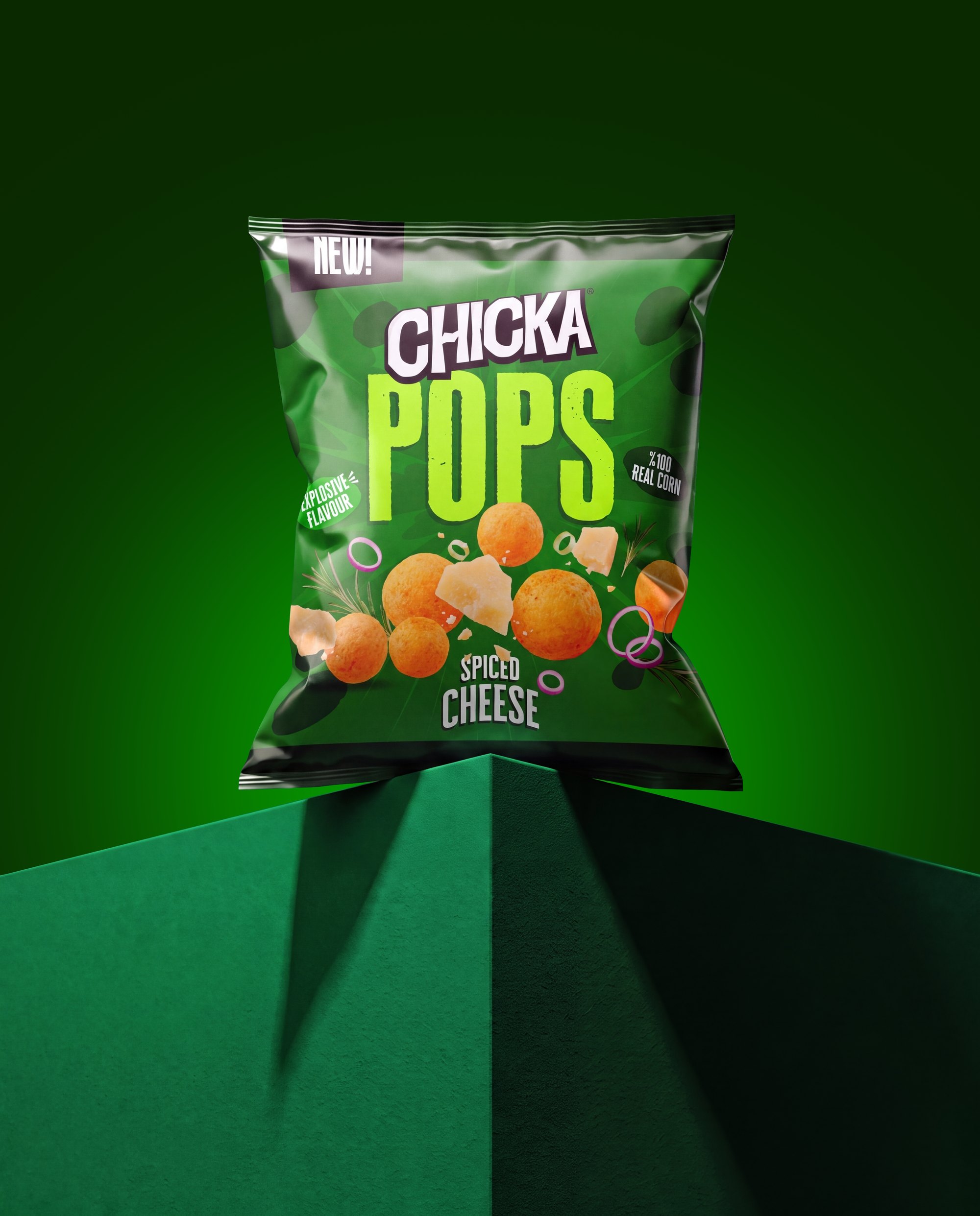 A green Chicka Pops Spiced Cheese pack on a green block, by Colada