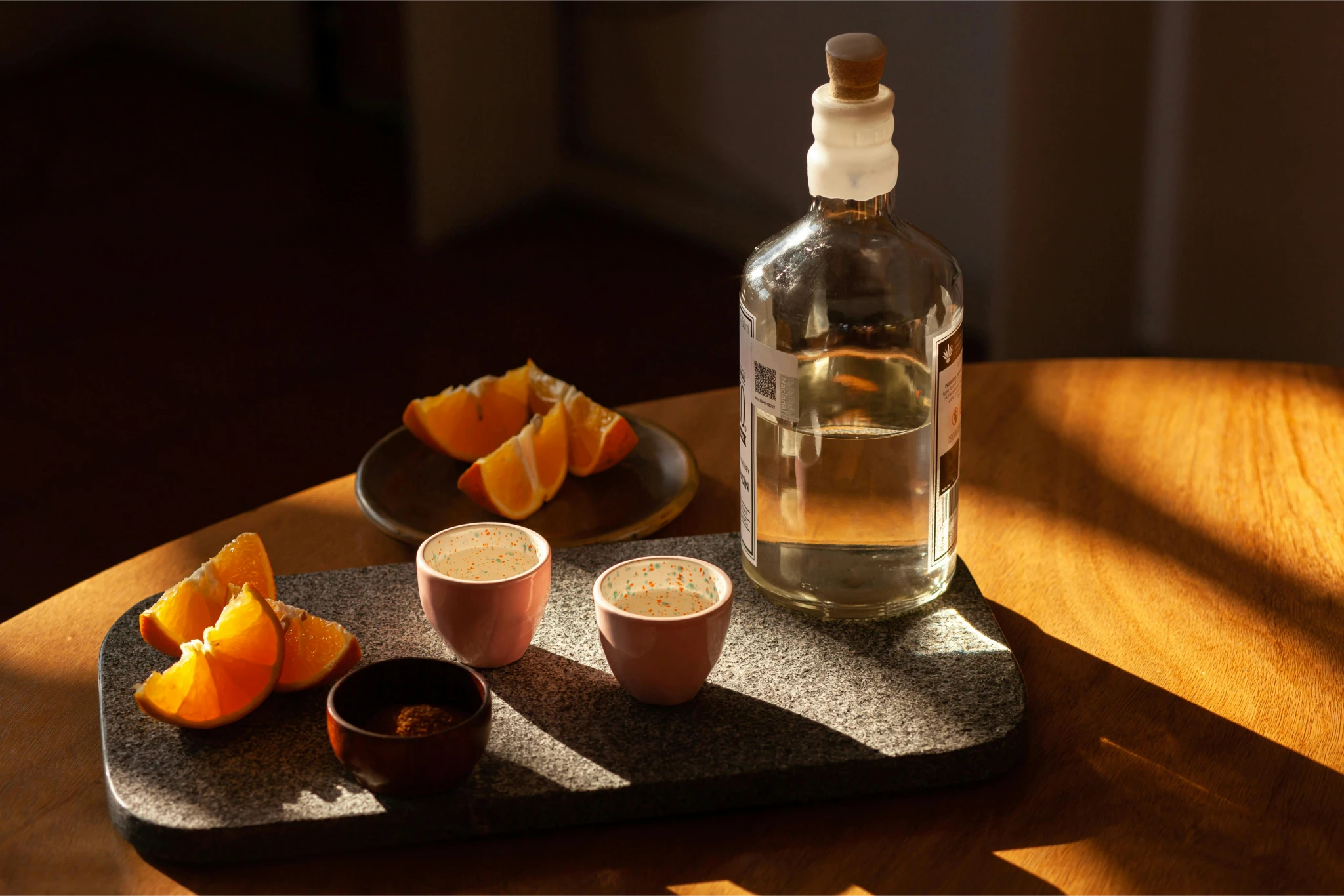 An orange cube-shaped side table is shown.