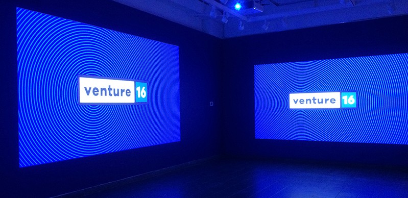 venture 16 exhibition logo projected on two walls