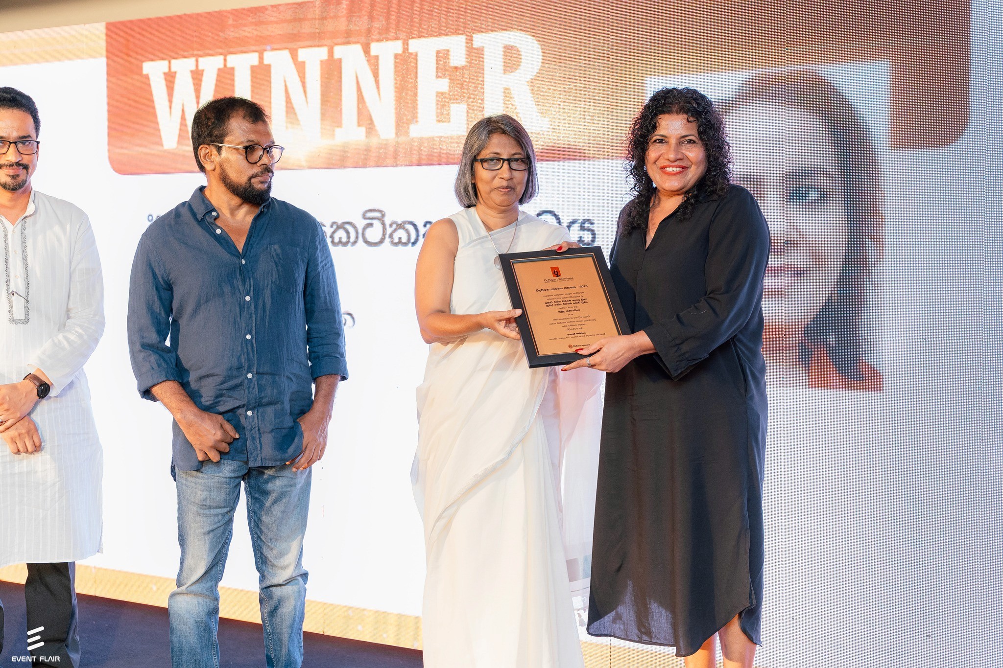 Cofounder of Sparksy are smiling to the camera at their office