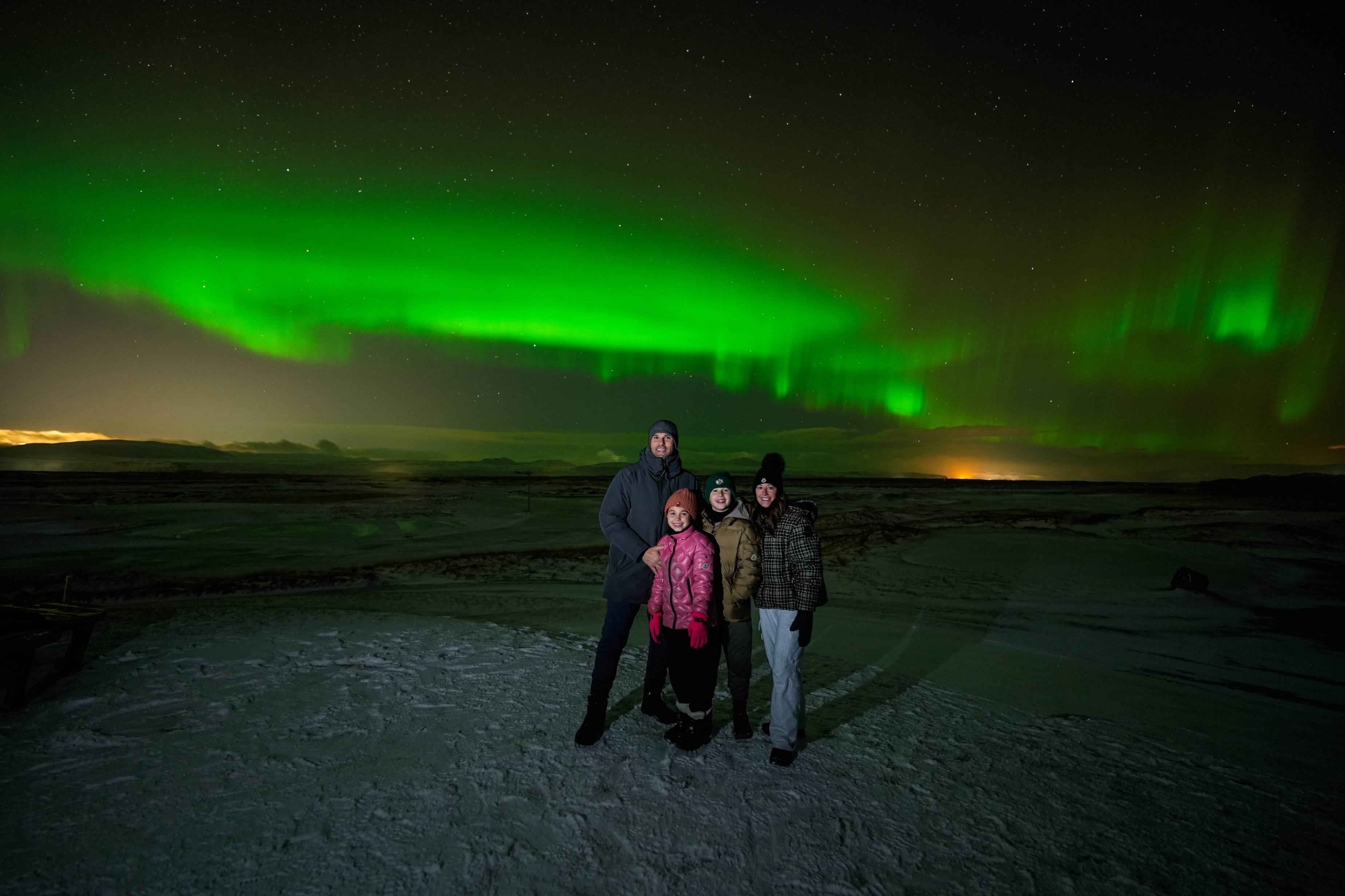 Northern Lights tour photography from Aurora Experts in Iceland, featuring guests beneath the aurora, winter landscapes, and vivid skies over remote Icelandic locations.
