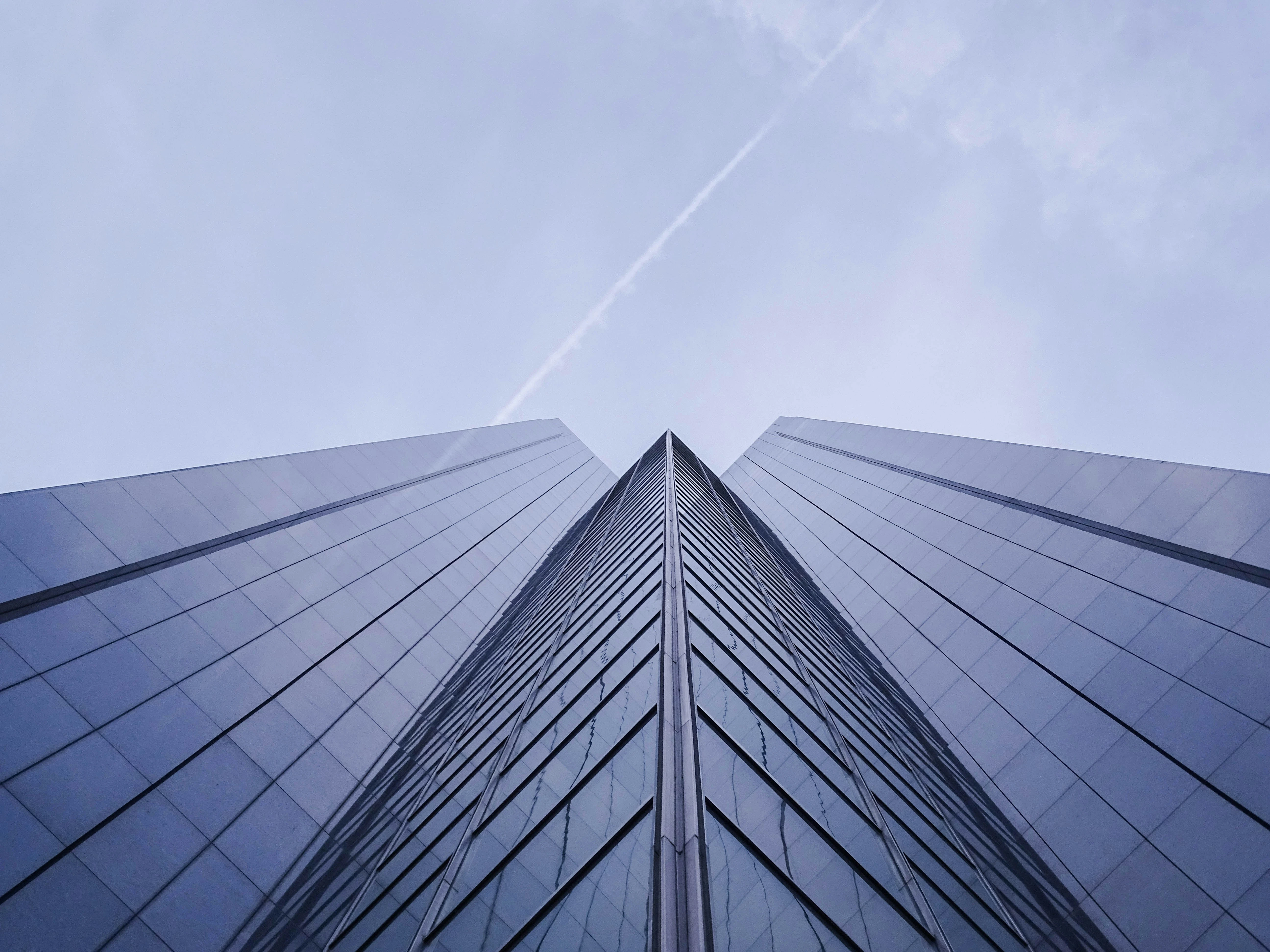 Tall building with a clear blue sky in the background.
