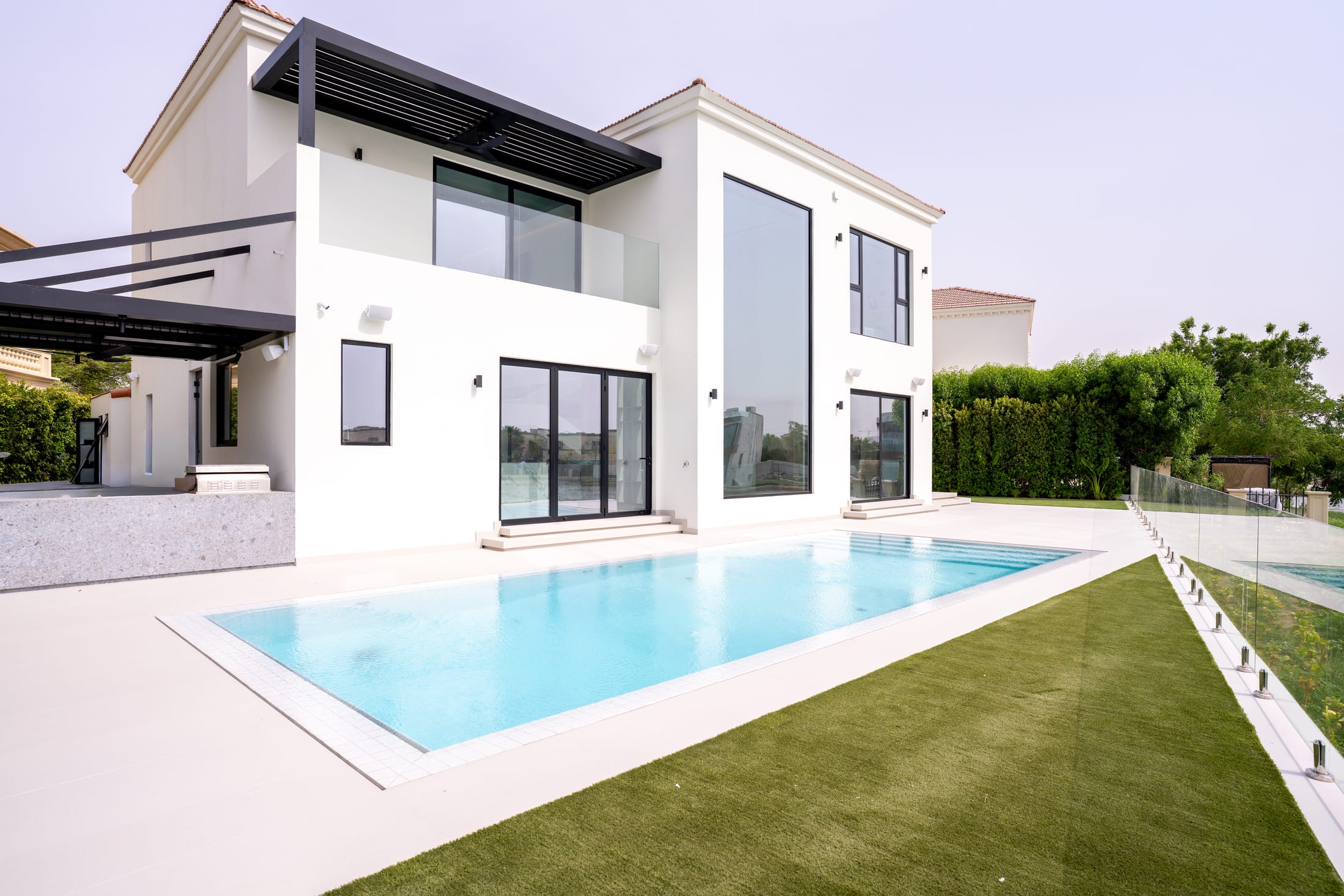 Image of a large villa with big glass windows