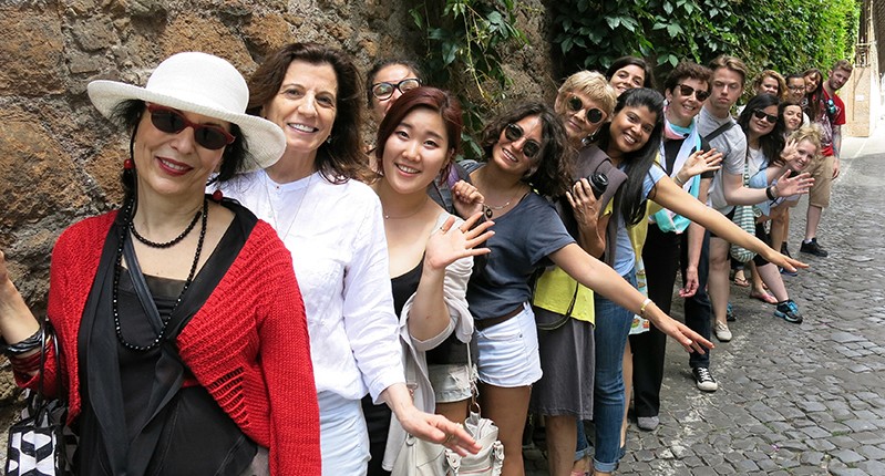 group of people by the wall