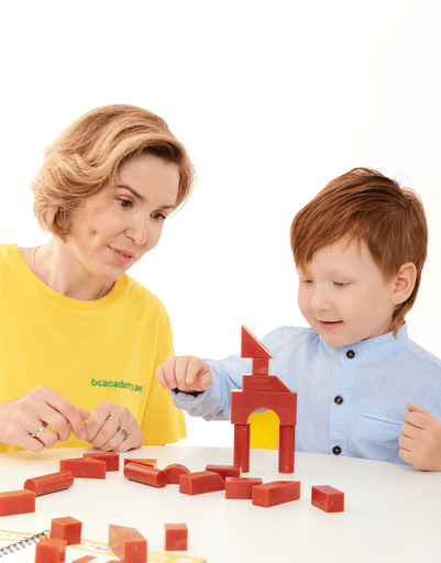 A woman and child playing with a game