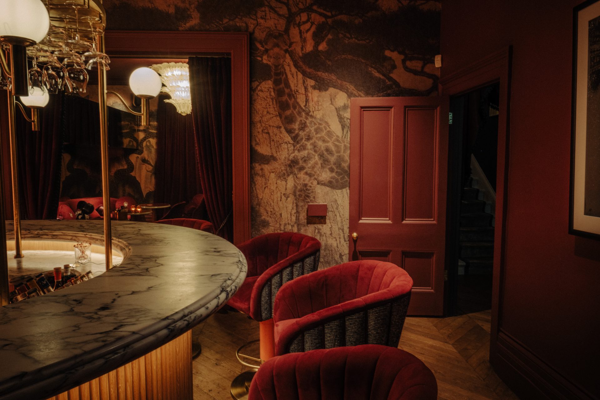 Club Ocho’s circular bar, red velvet seating and atmospheric interior