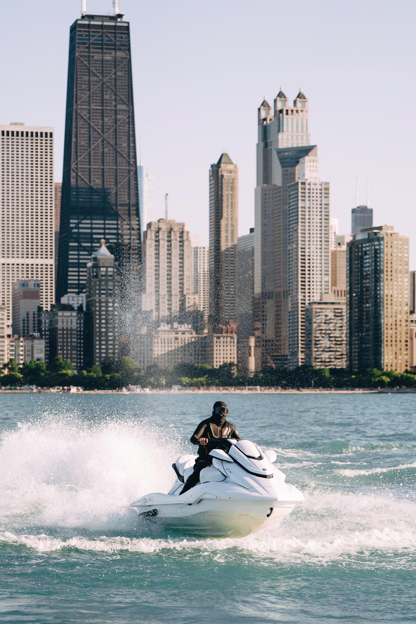 White Yamaha personal watercraft docked in bright daylight
