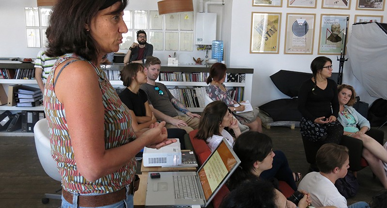 a woman presenting to a group