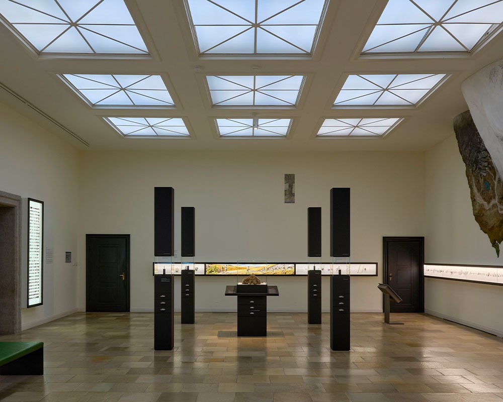 Streetside billboard with flyposters of the Batch.Works brand and illustrations