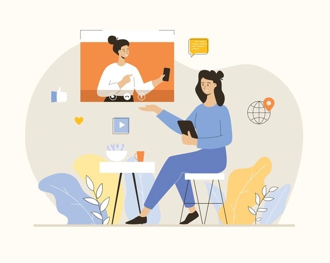 The image shows a professional woman participating in a video interview setup, dressed in business attire and sitting in a well-lit room with a laptop in front of her. She appears focused and engaged, likely discussing her relevant skills and career goals with a hiring manager as part of the interview process for her dream job.