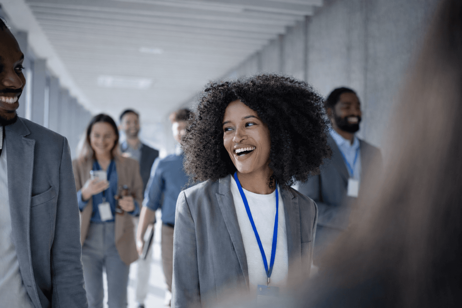 man sitting on couch with looking at his MacBook on table