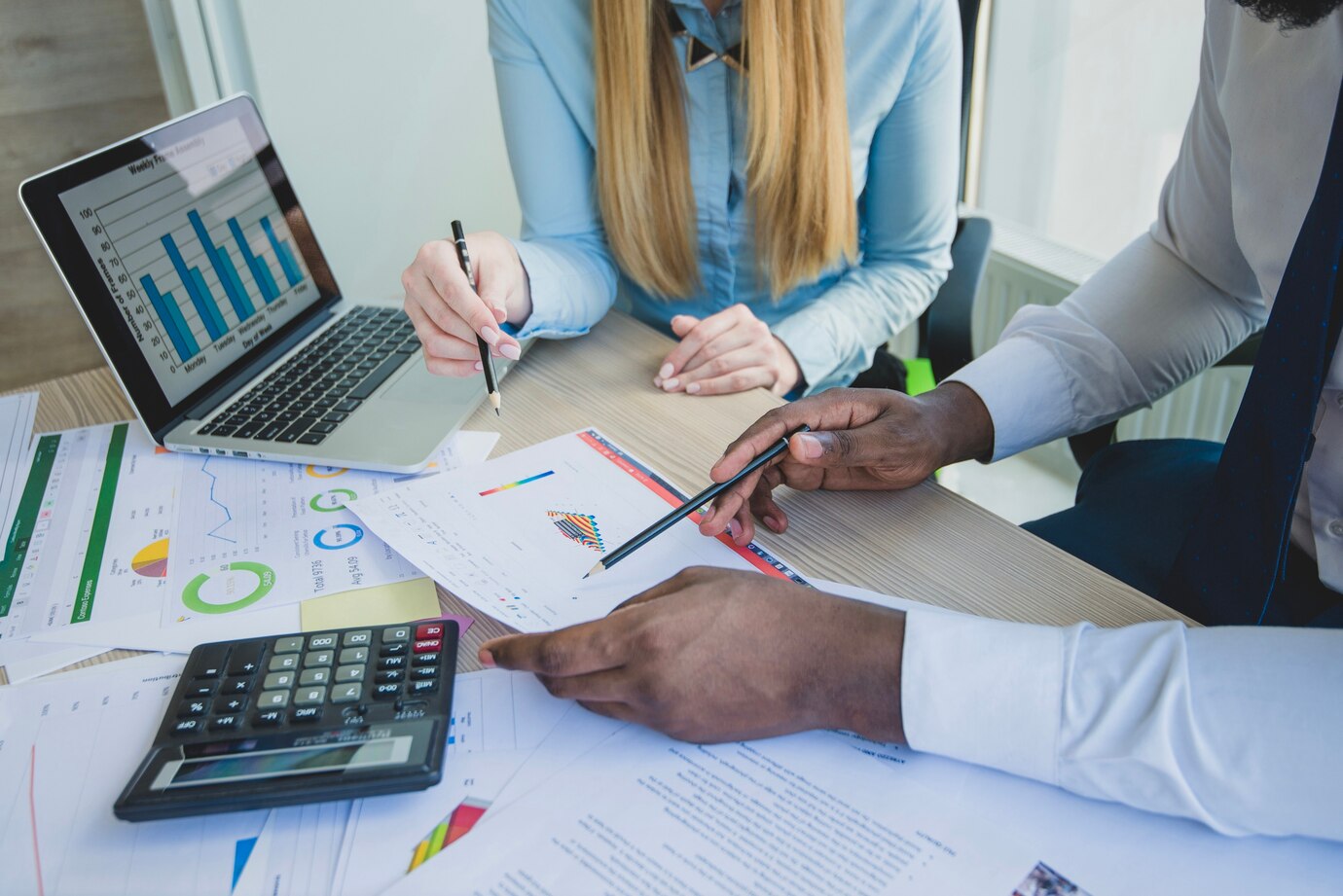 People signing documents for real estate property