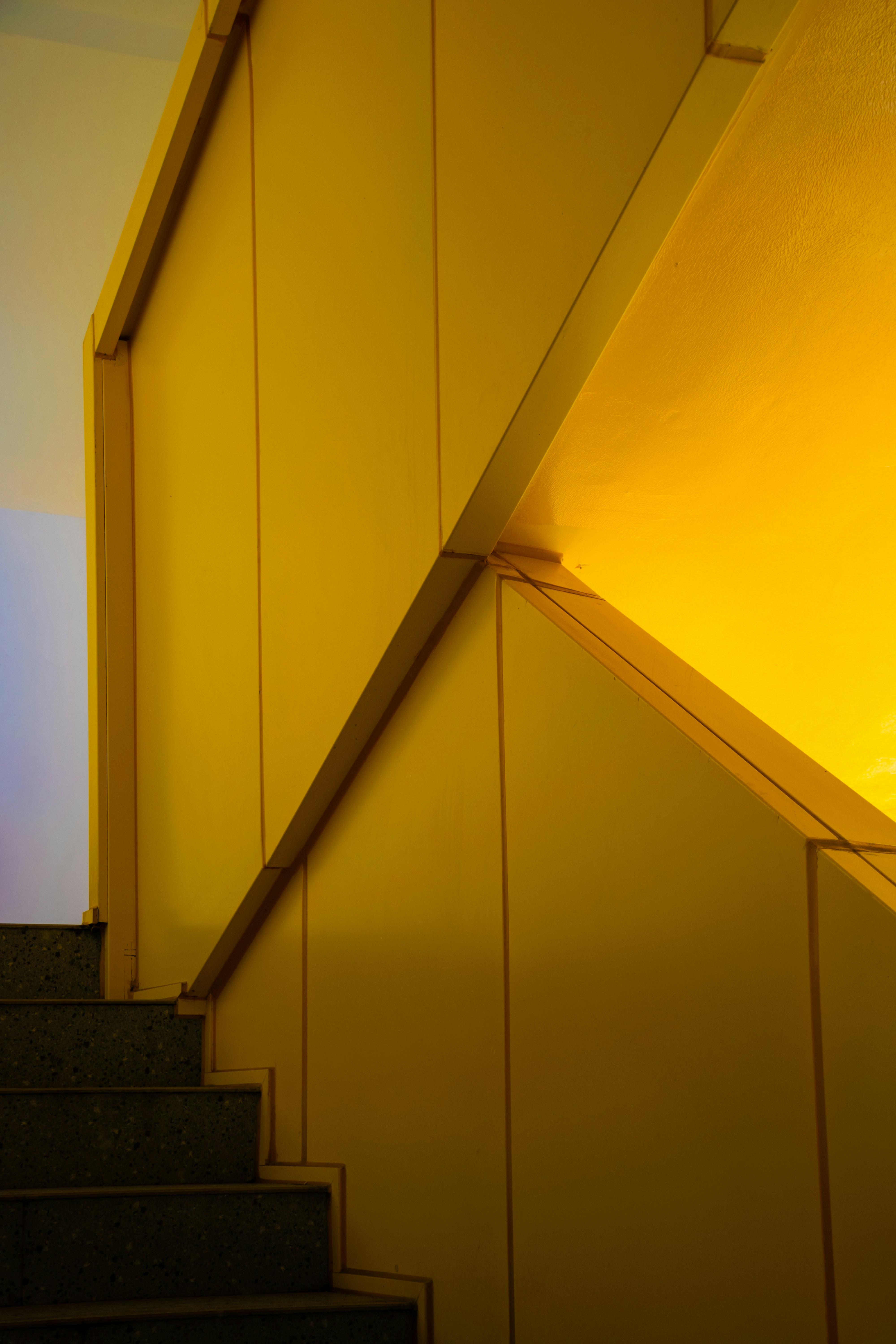 Modern yellow staircase with geometric patterns
