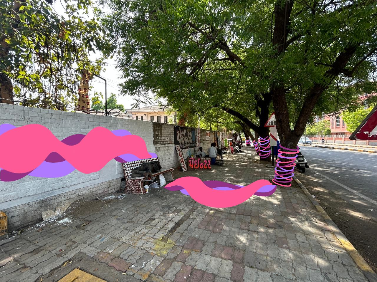 Modern home office setup with a monitor, ergonomic chair, keyboard, and indoor plants near a window with blinds.