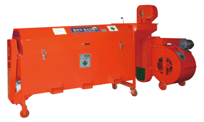 A blank white card resting on a softly draped rust-colored fabric atop a beige quilted surface.