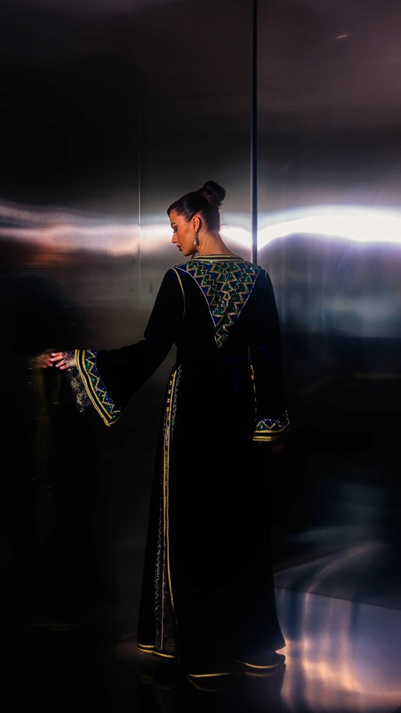 Deepsea Blue Moroccan caftan with gold and green embroidery, handcrafted couture design inspired by traditional Moroccan artistry