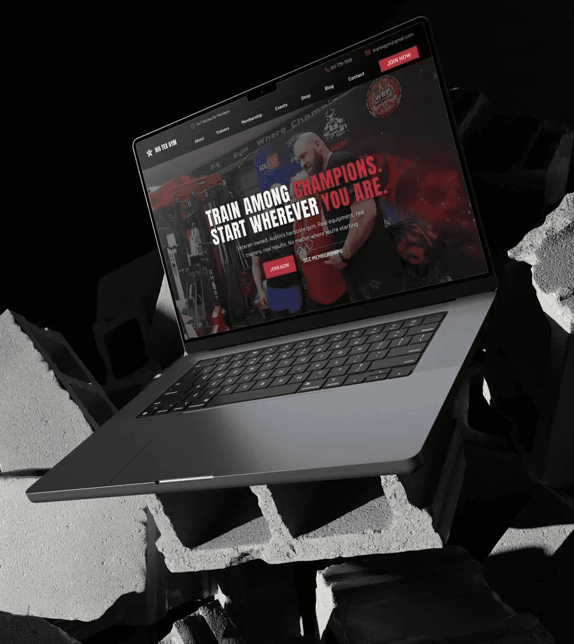 A laptop on a futuristic stand displays a vibrant website against a dark background.