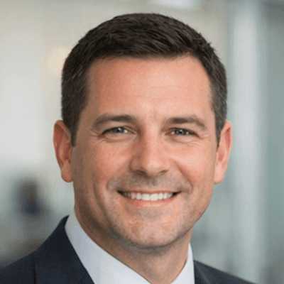 a man in a blue suit posing for a picture