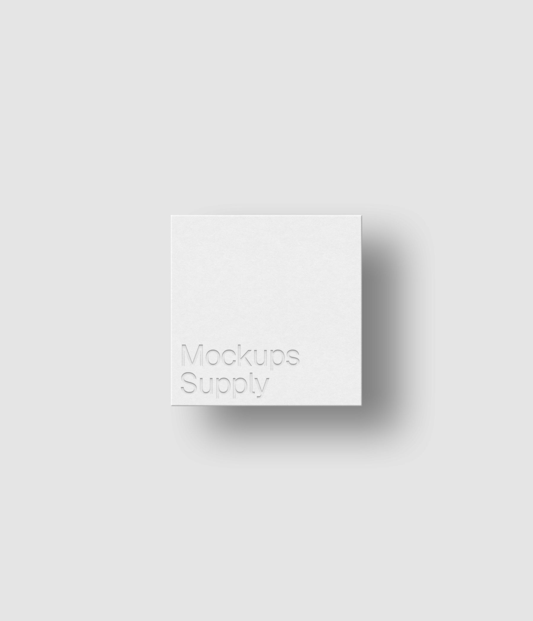 Square business card mockup for Photoshop with shadow and debossed text effect, white card on white background, minimal branding and stationery presentation