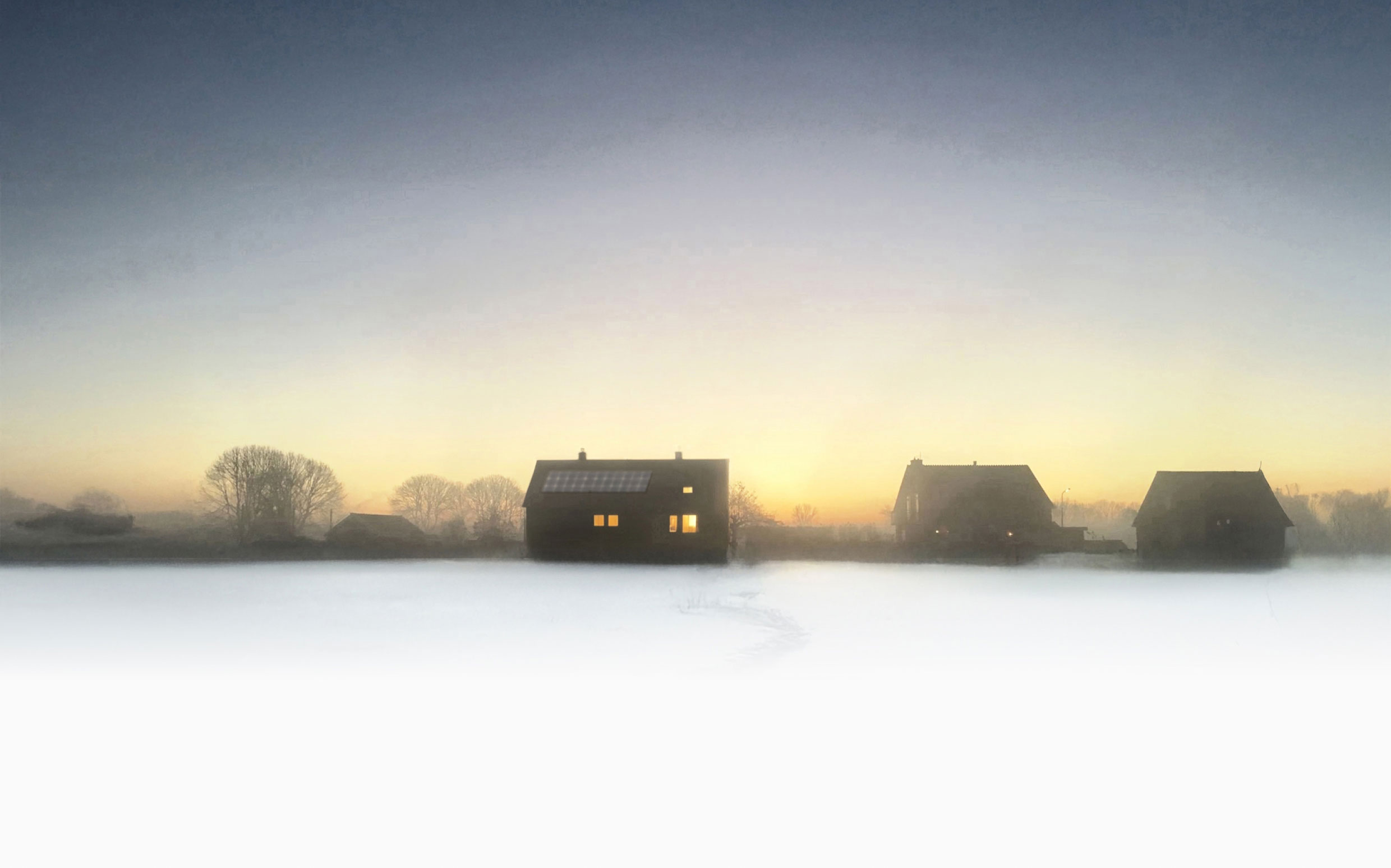 Eeen Nederlands landschap in de kou met ene heerlijk verwarmd huis.
