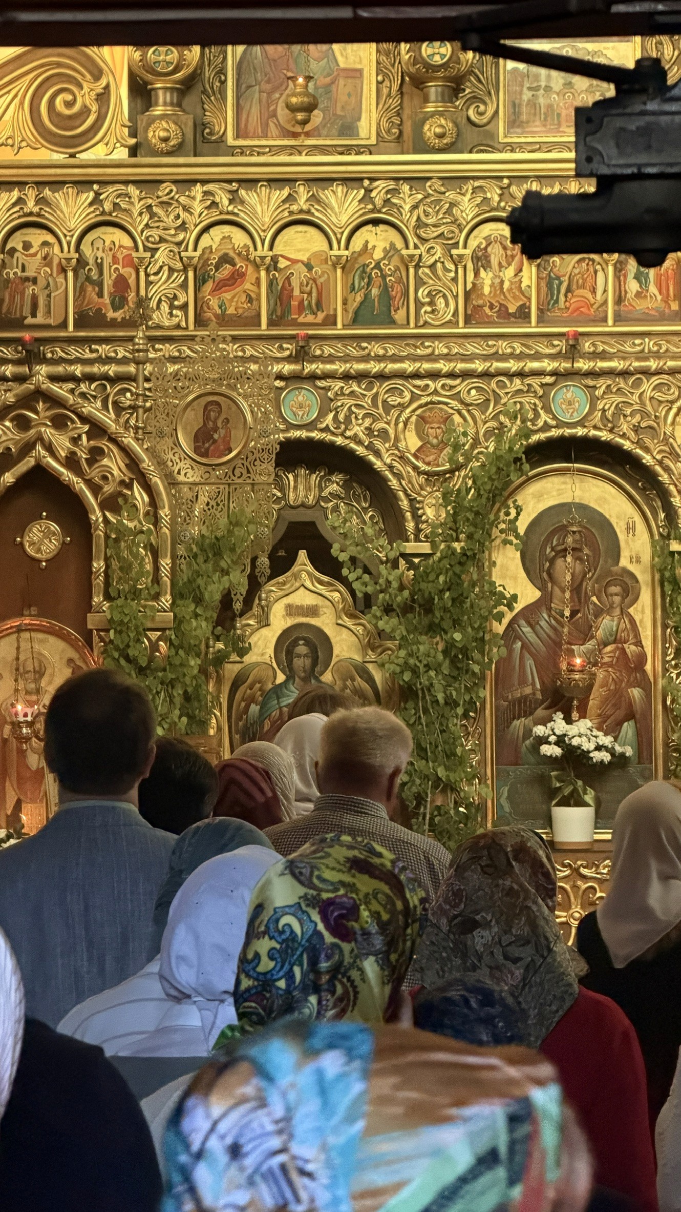 The congregation before the gilded iconostasis at Holy Trinity on a feast day