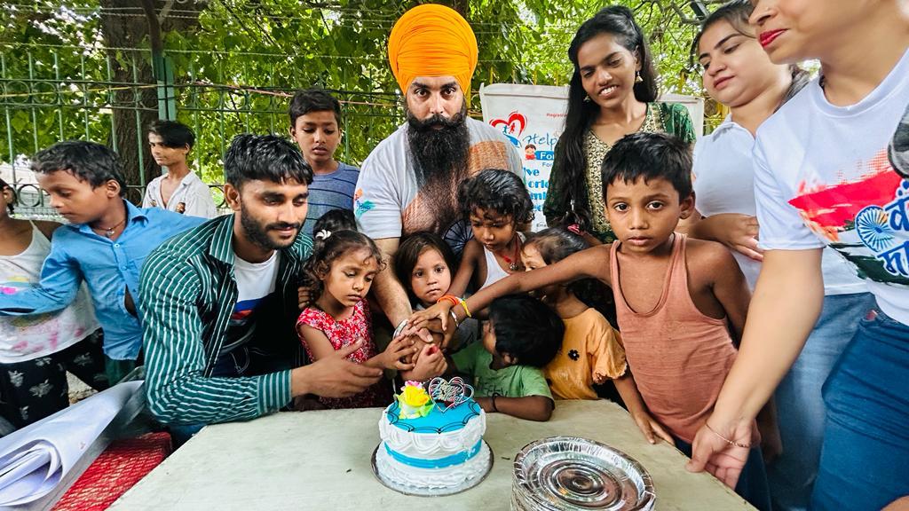 a group of children sitting on steps in front of a building