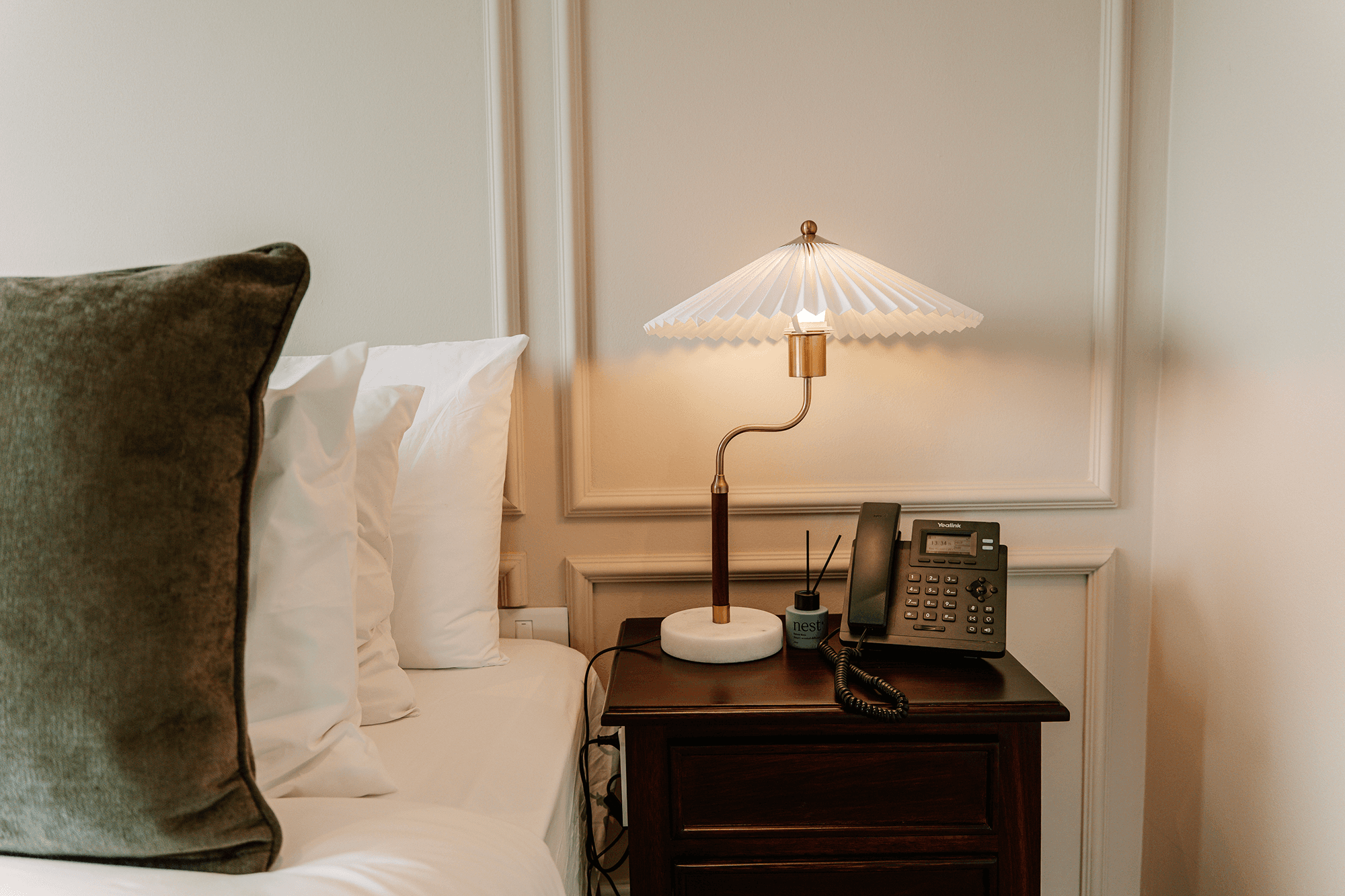Redlands Hotel Premier Room bedroom featuring plush bed and serene ambiance.