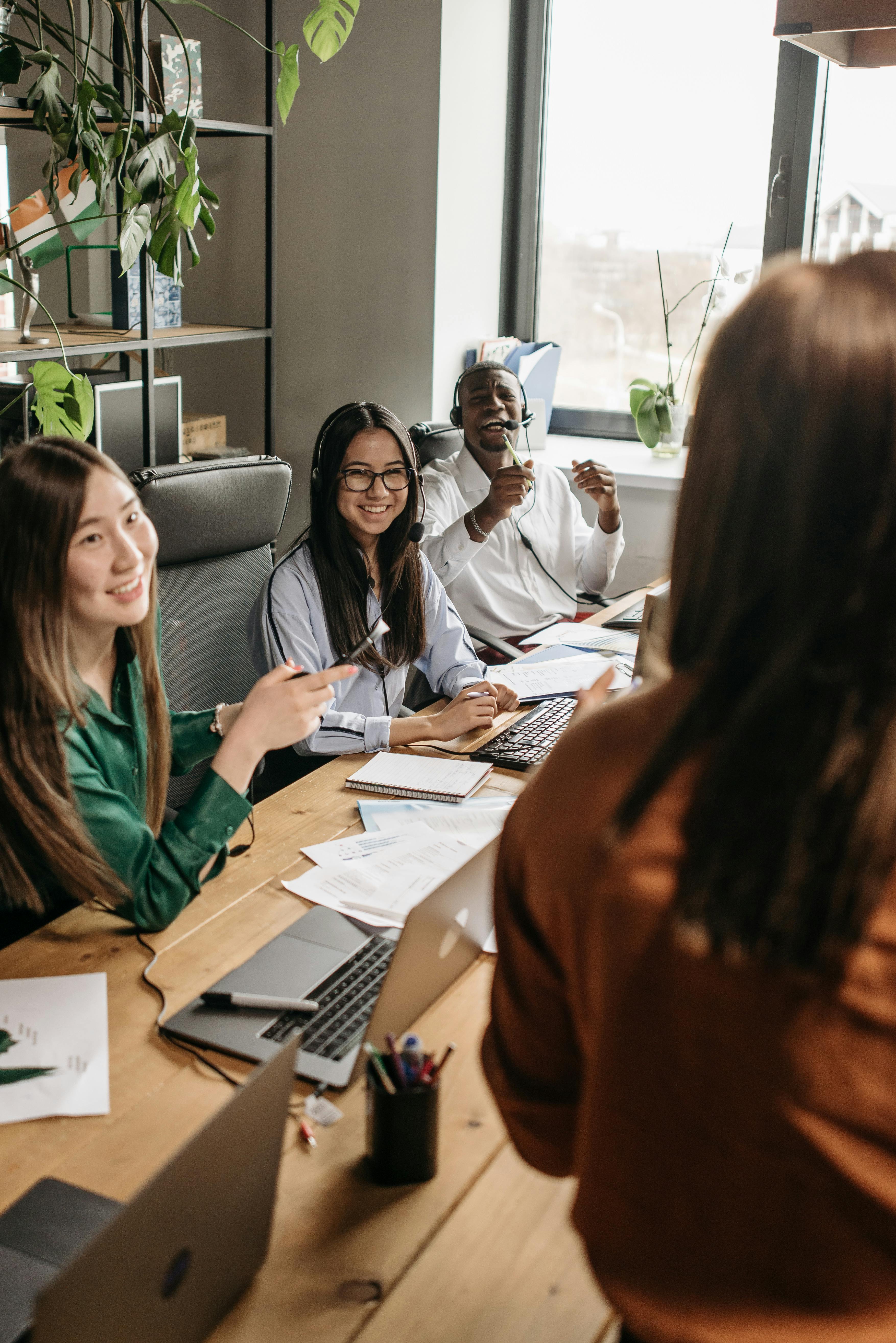 a-diverse-group-of-young-professionals-collaborating-around-a-table-in-a-modern- - pavel-danilyuk (pexels)