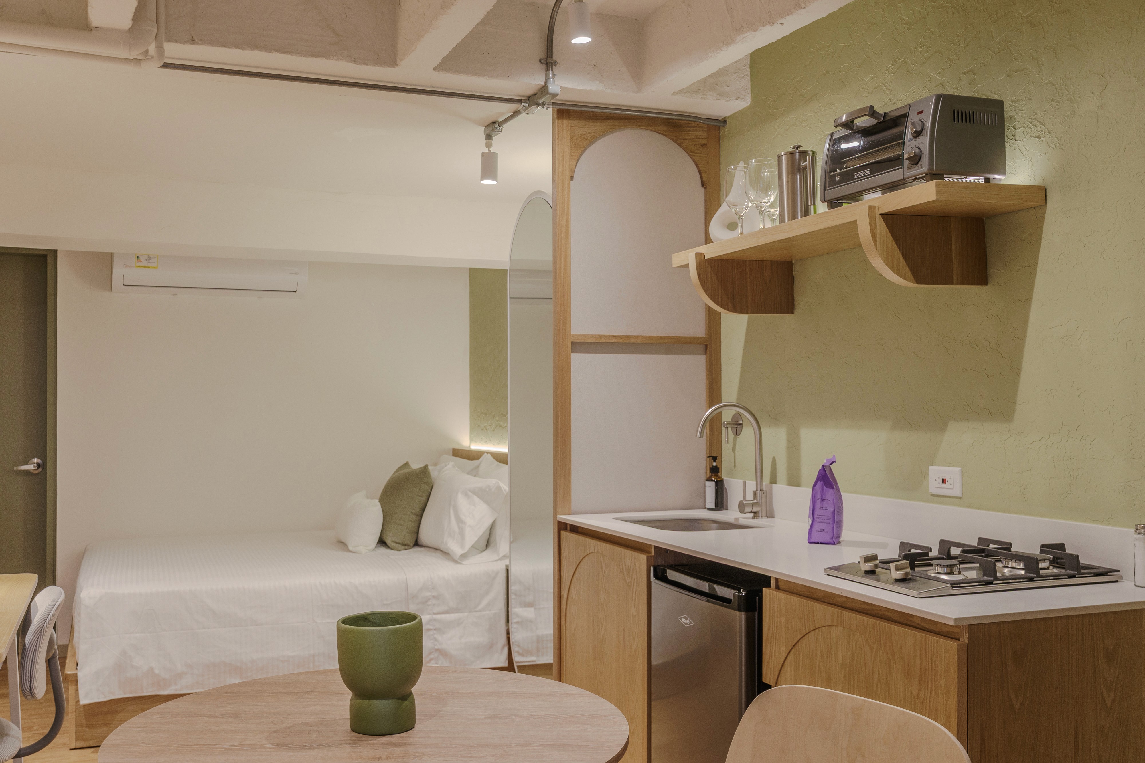 Double-height interior with flowing sculptural forms and warm raking light