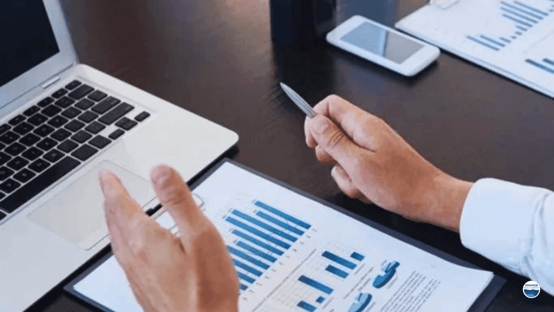 Homeowners comparing financing options for fiberglass pool installation