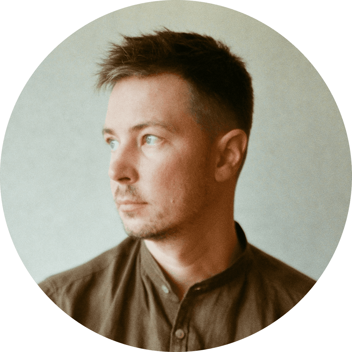 Shirtless man sipping espresso