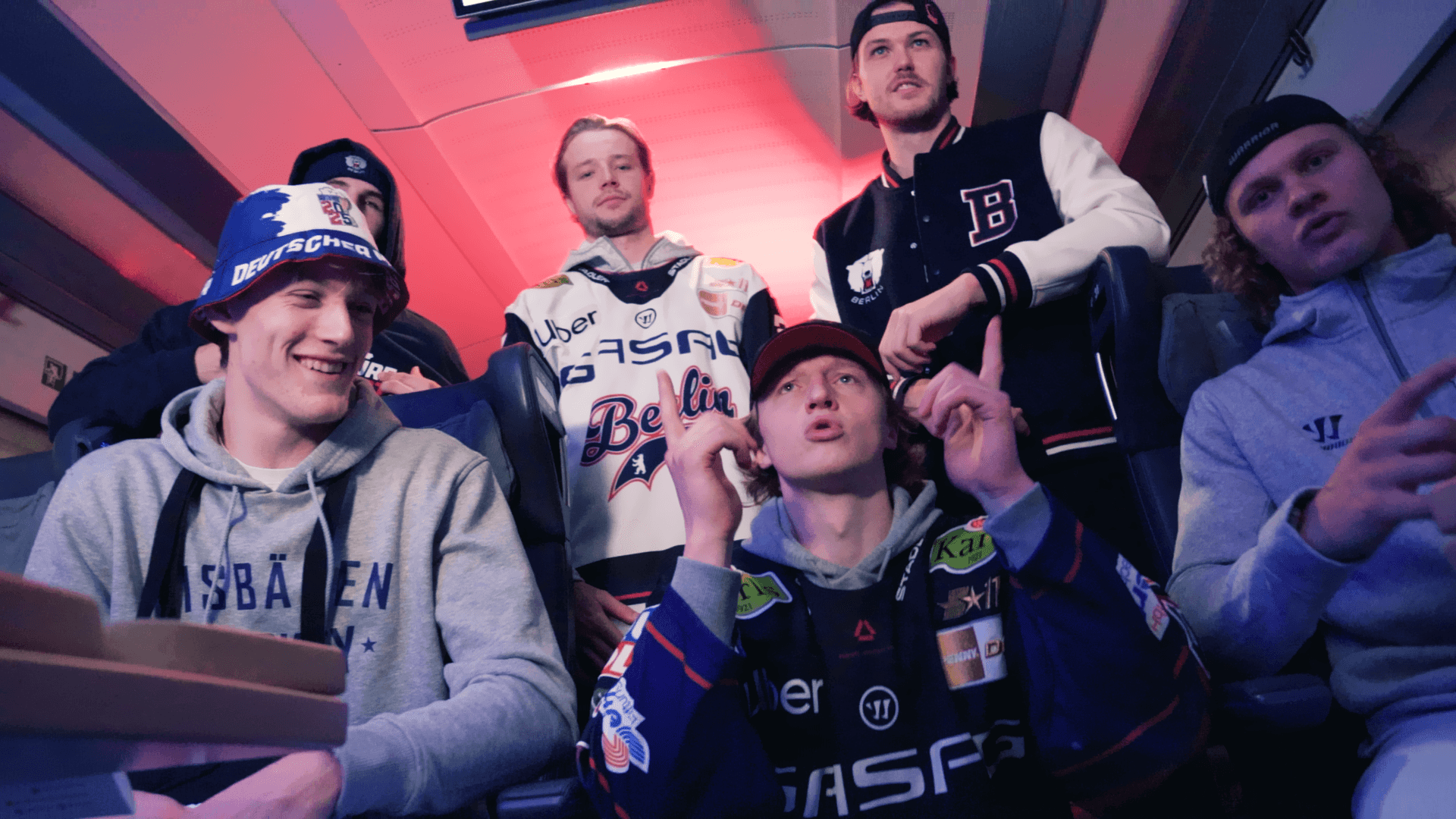 6 eisbaeren berlin ice hockey players looking into camera for the deutsche bahn music video