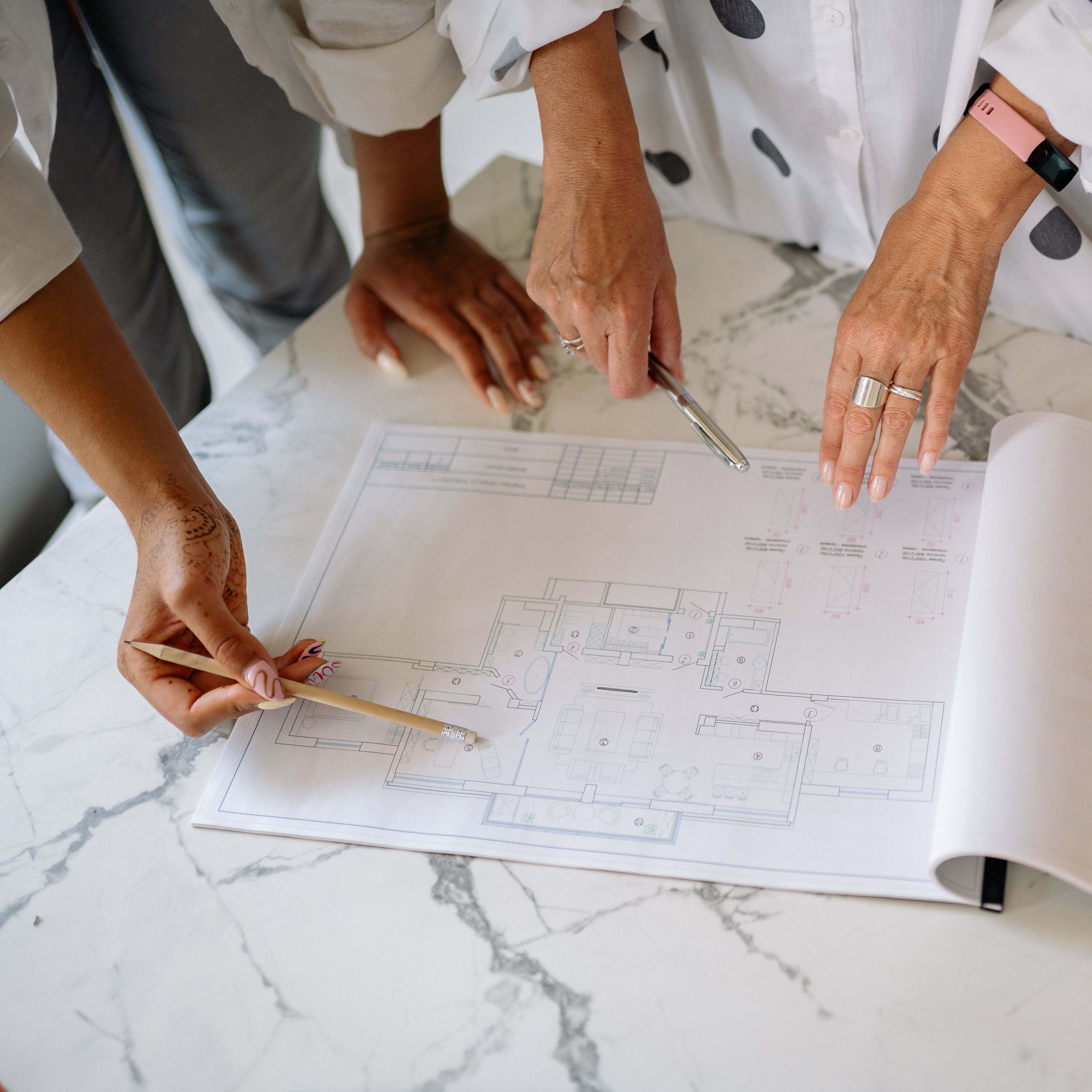 women-collaborating-on-architectural-plans,-emphasizing-teamwork-and-precision. - yan-krukau (pexels)