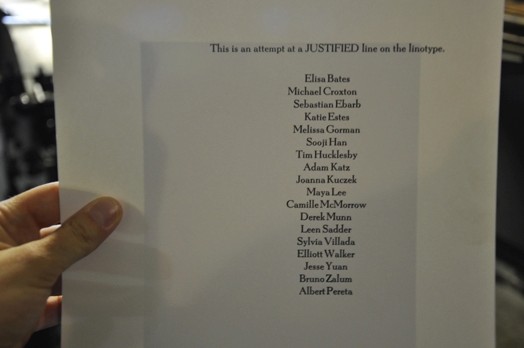 A photo of a piece of paper with names on it, freshly made by a printing press.