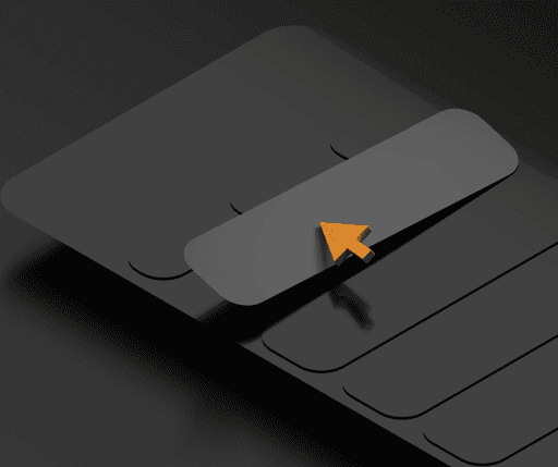 a computer keyboard with a yellow arrow on it