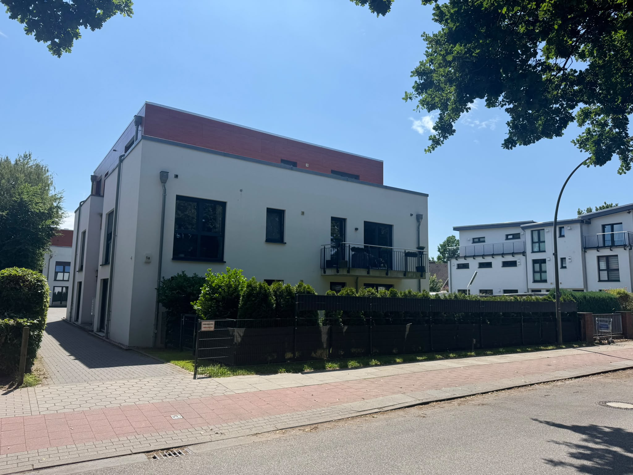 white modern cement building under blue sky