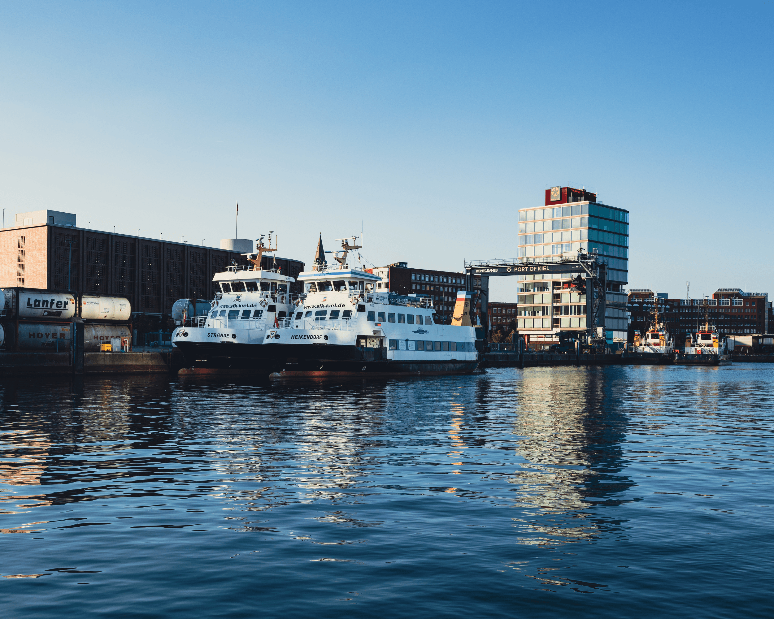 kids lying on a glass land and smiling