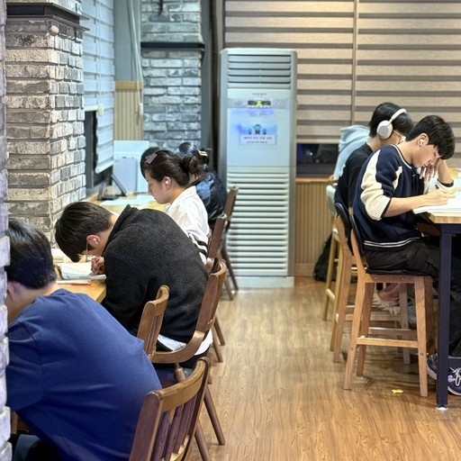 A man is walking in the middle of the street.