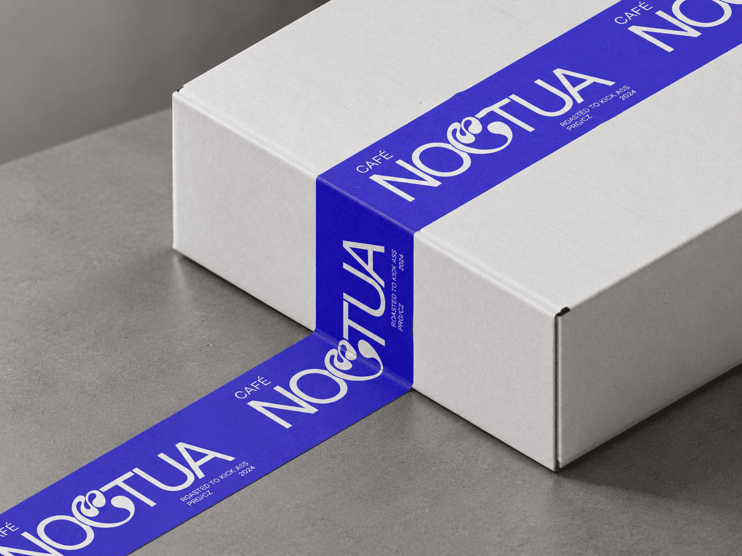Noctua café identity applied across coffee packaging and the physical space