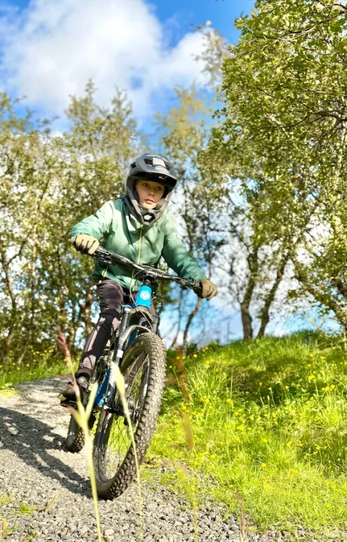 boy rides mtb towards camera
