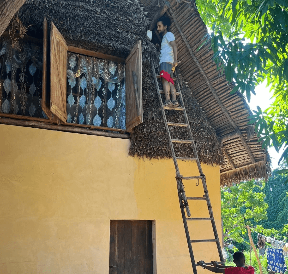 person sitting in a chair in front of a man
