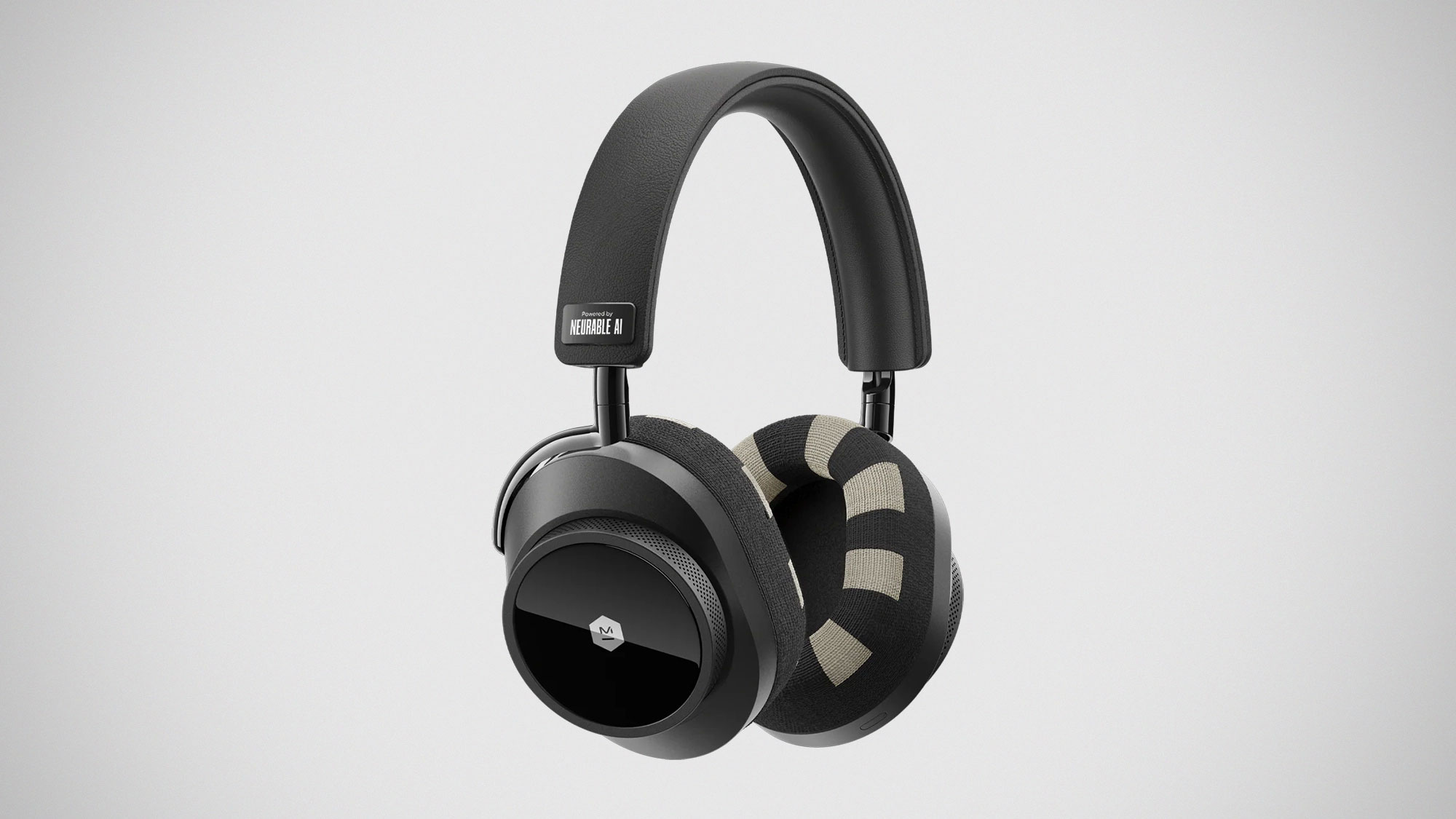 Black and white over ear headphones floating on a green gradient background