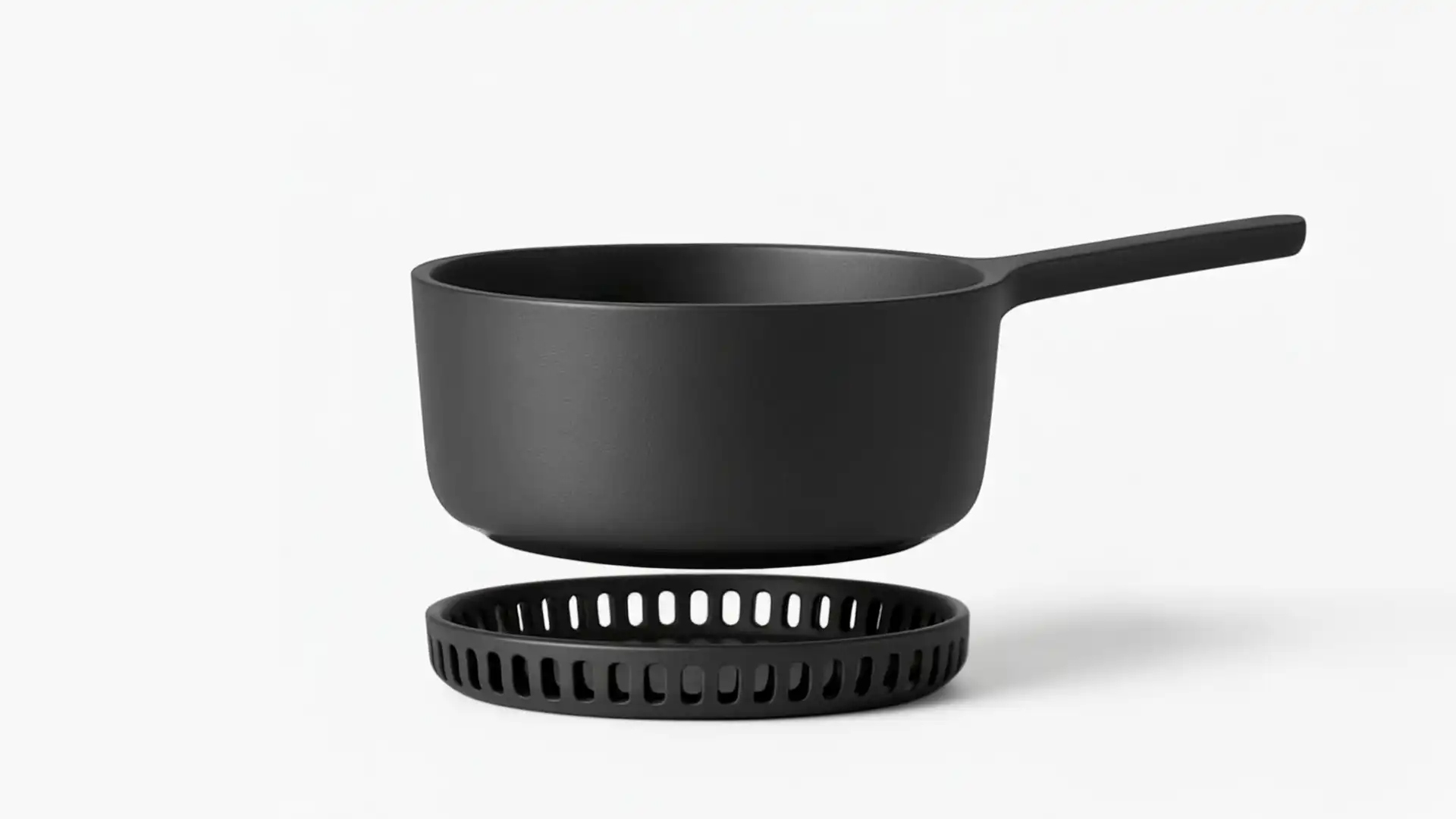 minimalistisch gietijzeren kookpot en onderzetter concept