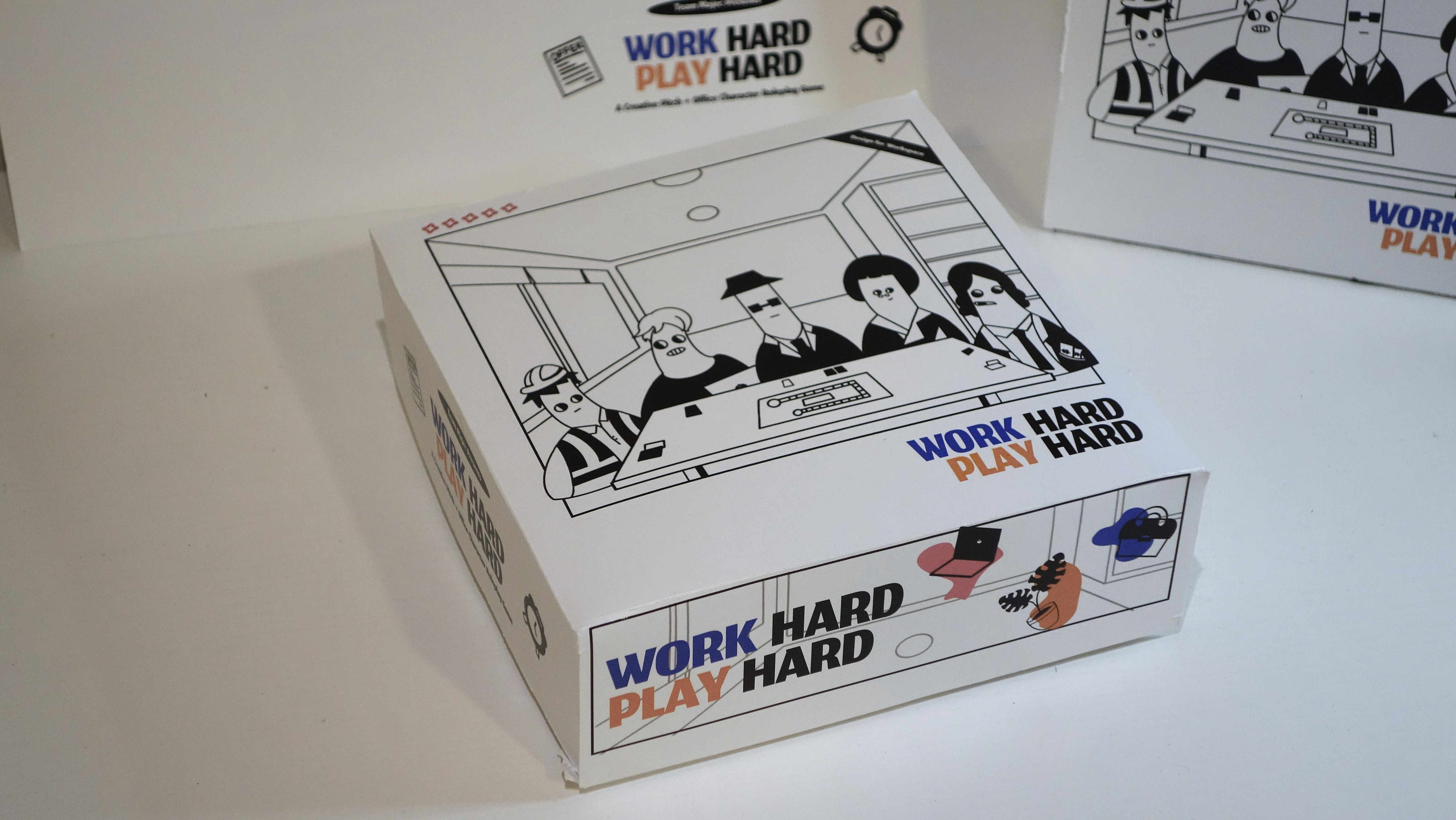 woman holding a phone and man looking at the phone. both are smiling