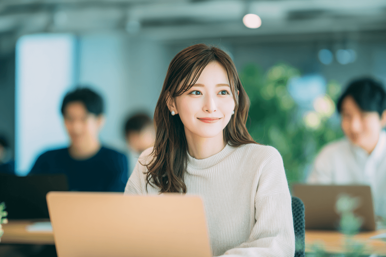 people sitting on chair in front of table while holding pens during daytime
